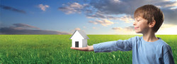 boy holding house 250x90 boy holding house
